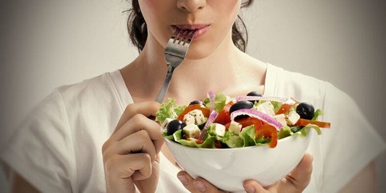 The girl eats right to avoid problems with excess weight